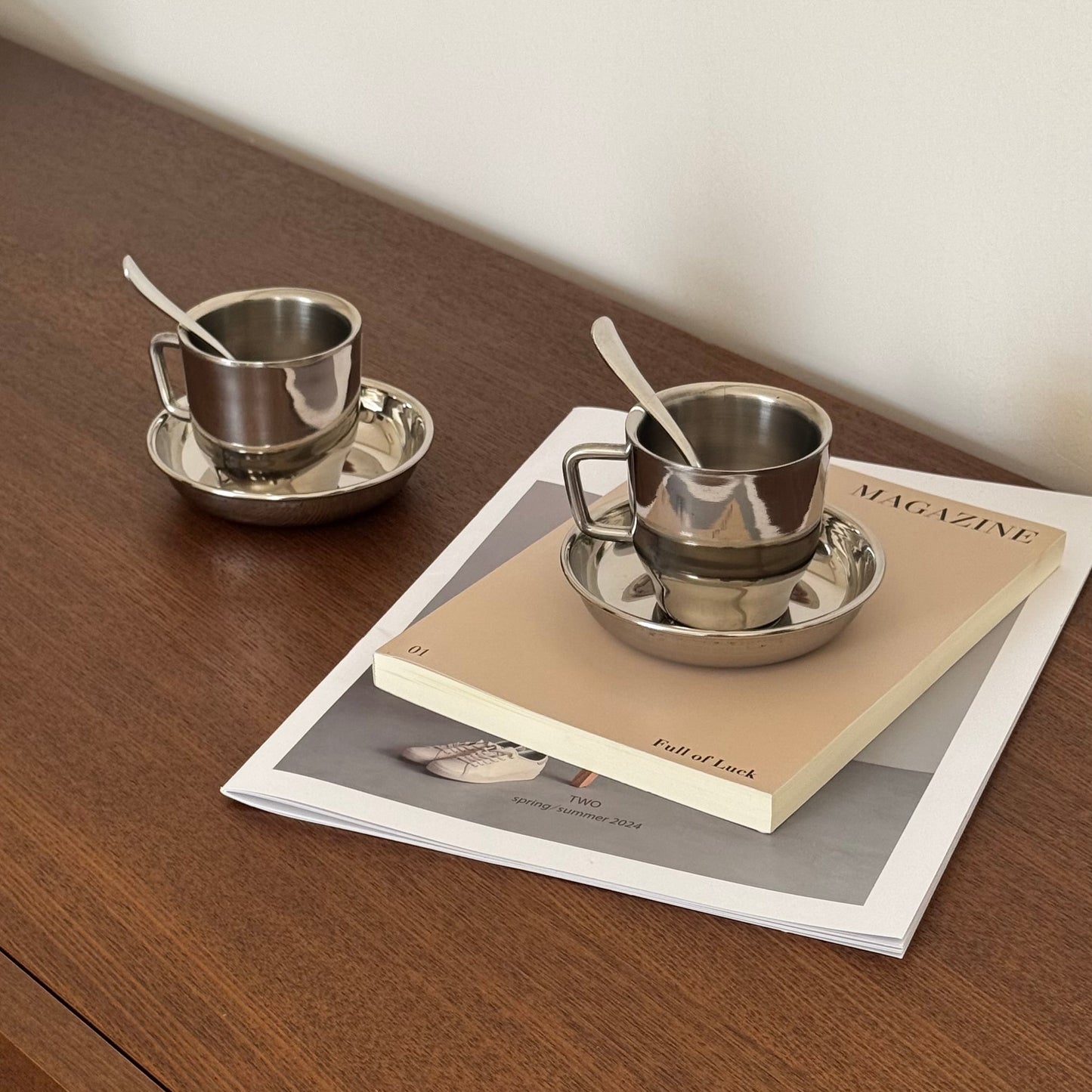 4 Silver cups with saucers and spoons