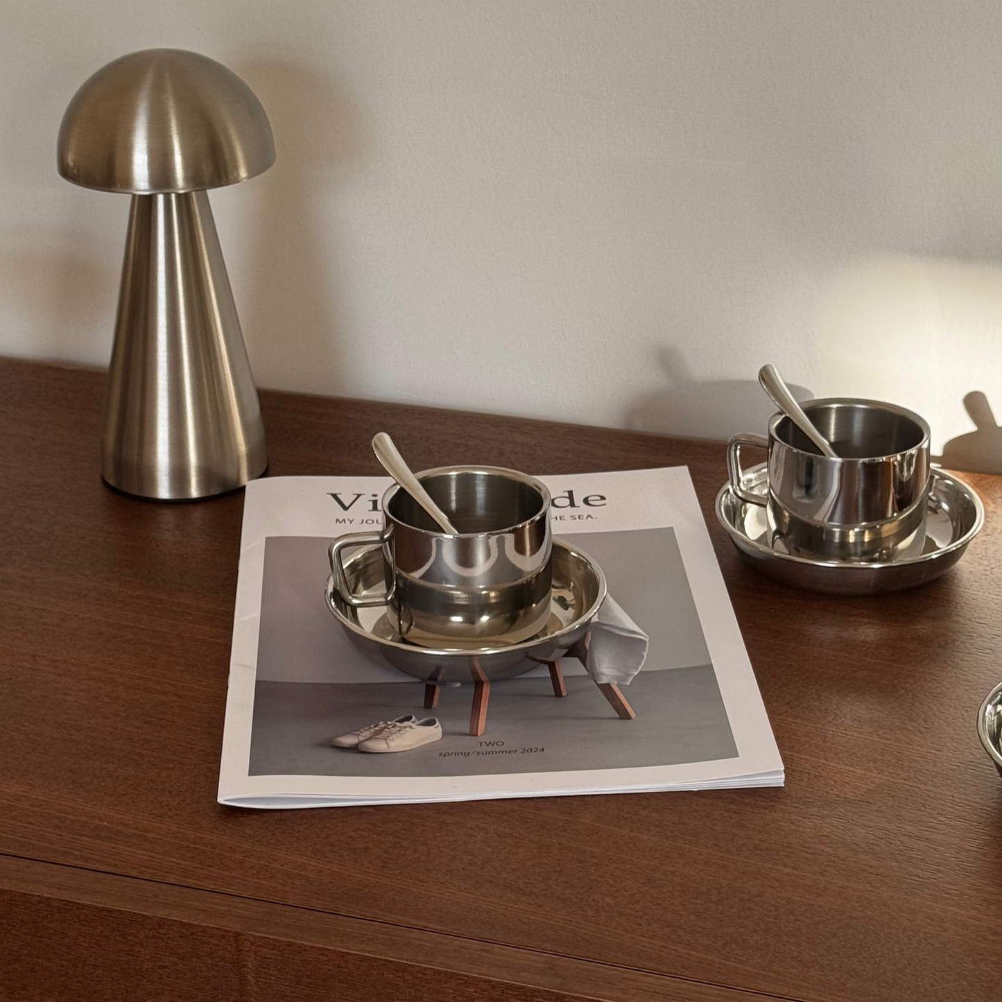 4 Silver cups with saucers and spoons